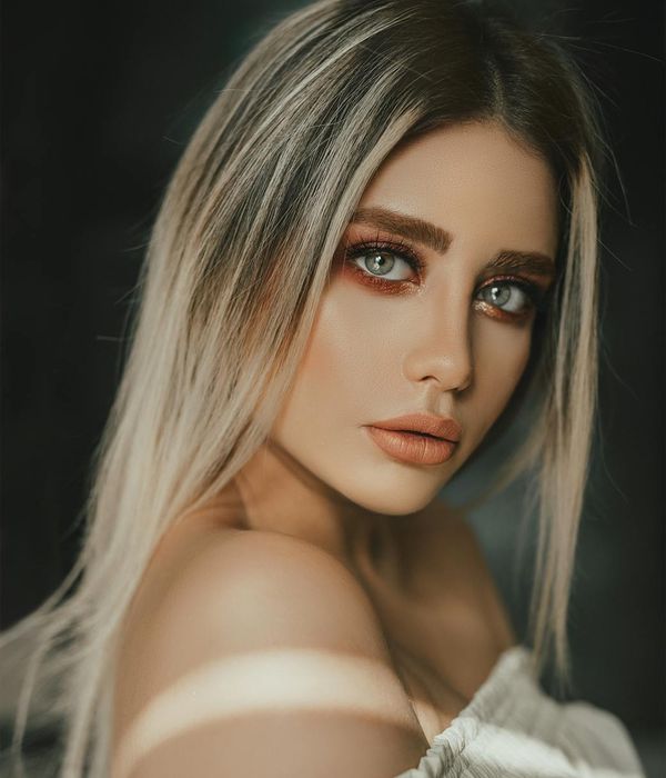 Woman with calm expression looking into distance focus exercise